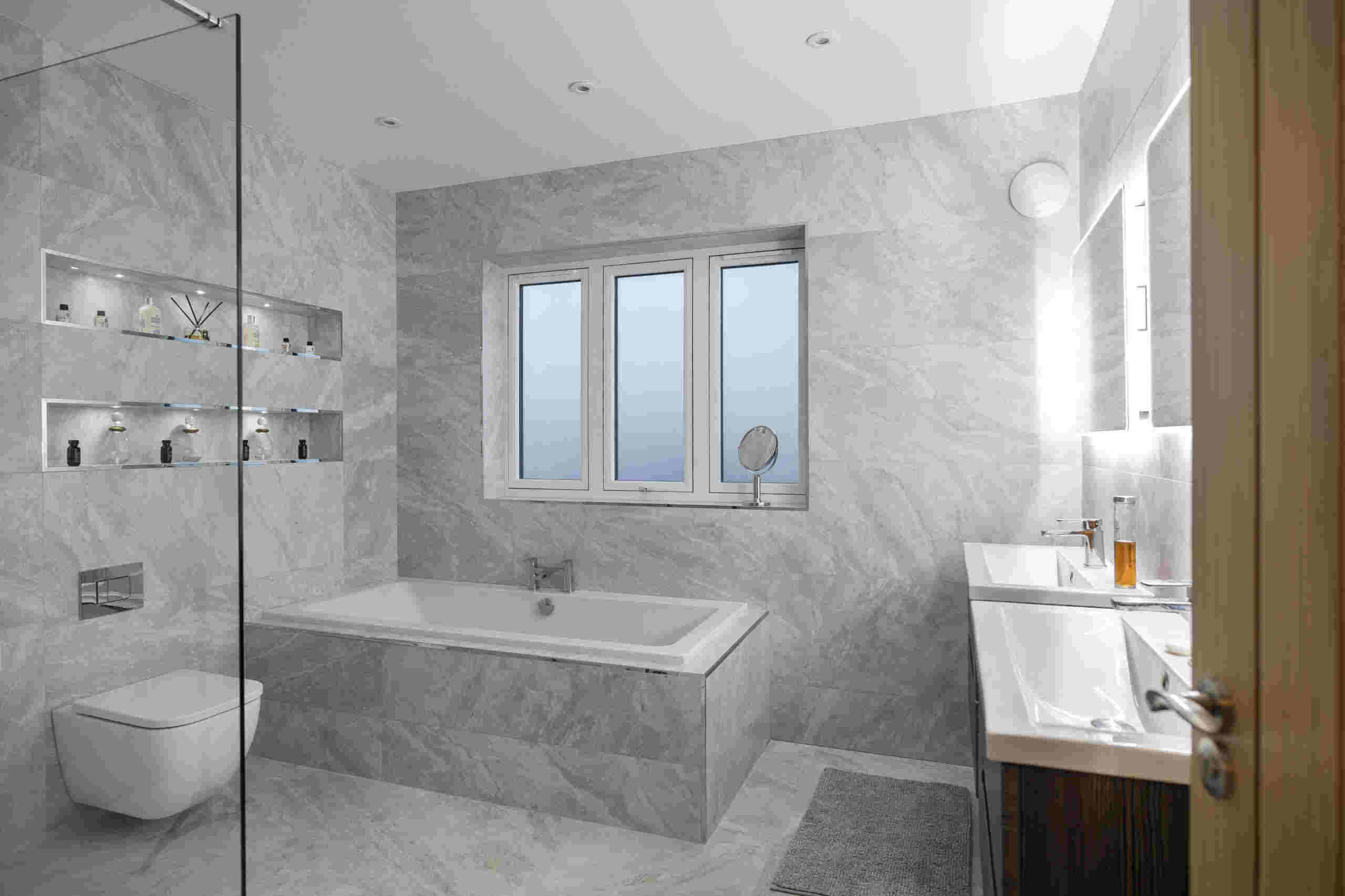 marble bathroom with residence 7 windows